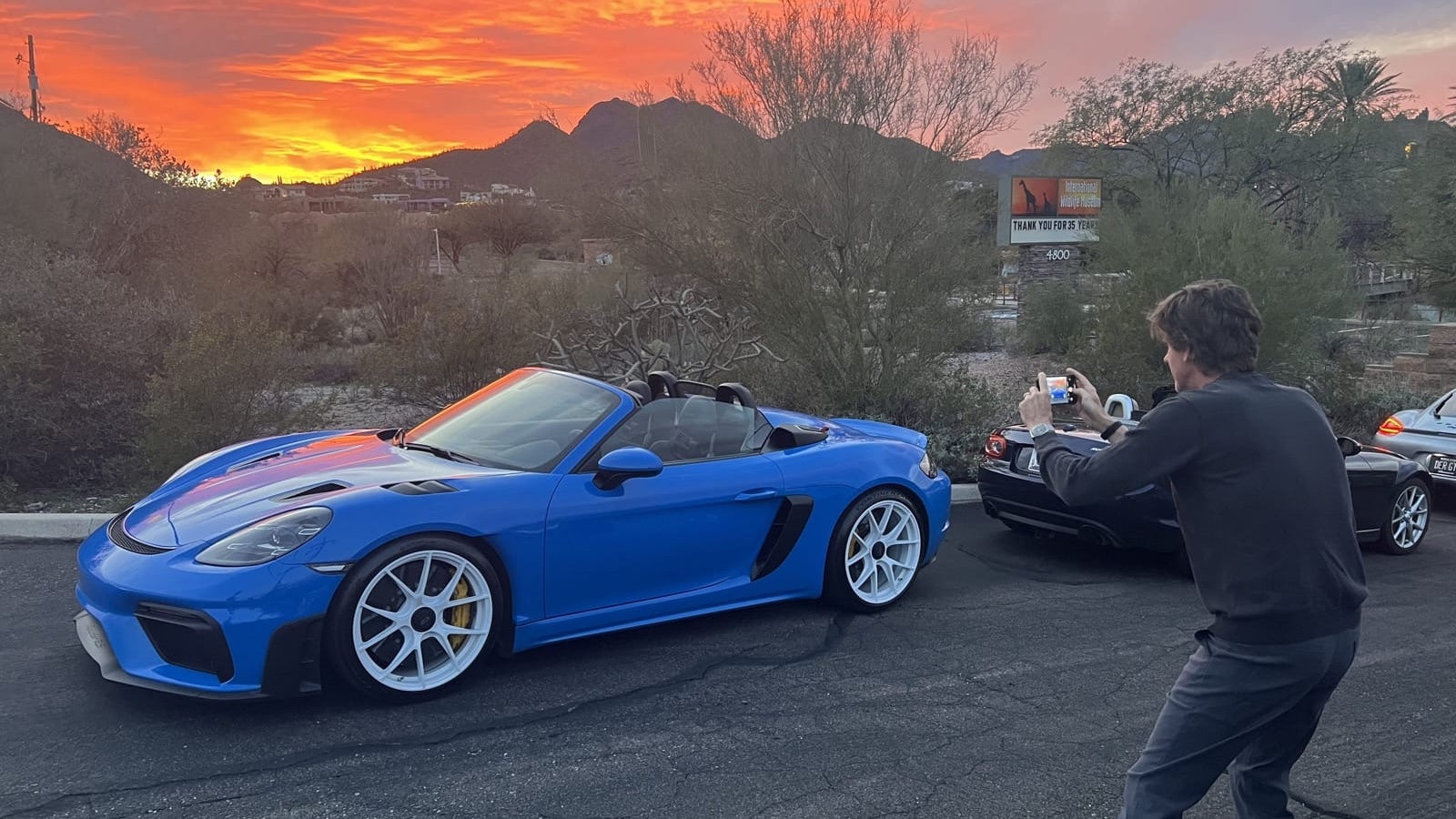 Blue Porsche Spyder at sunset